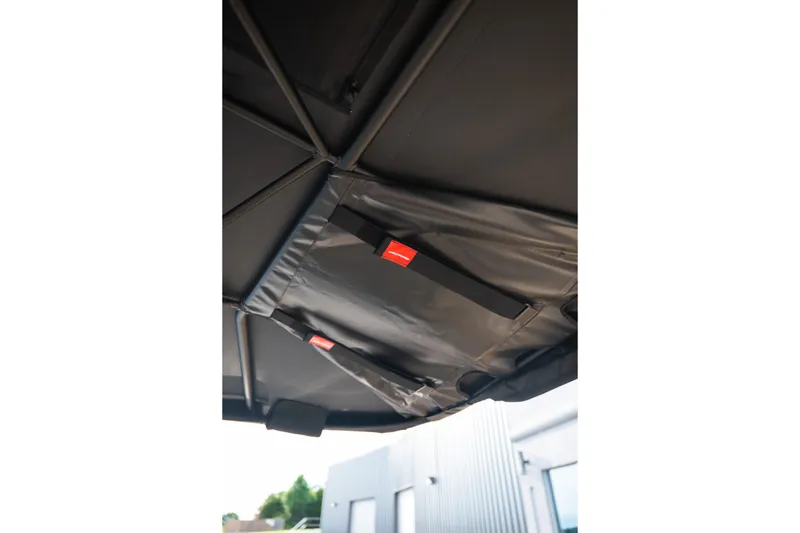 Slide: The Image of 2026 MasterCraft XStar 23 boat canopy with secure straps and durable material. - 38