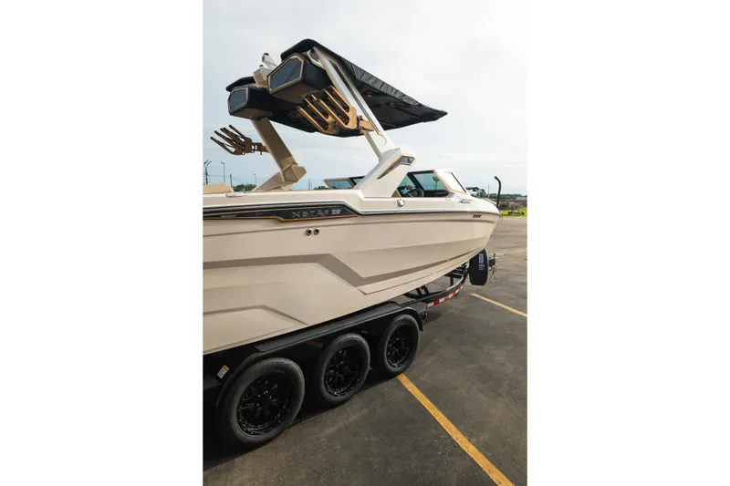 Slide: The Image of 2026 MasterCraft XStar 23 boat on trailer, showcasing sleek design and modern features. - 40