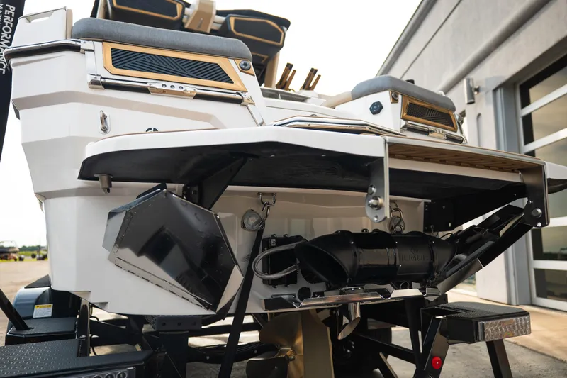 Slide: The Image of 2026 MasterCraft XStar 23 boat rear view, showcasing sleek design and advanced features. - 7