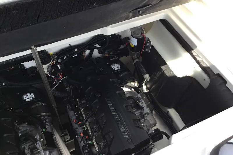 Slide: The Image of Engine compartment of 2023 Yamaha Boats 252XE, showcasing high-output engine components. - 32