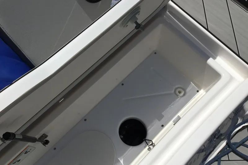 Slide: The Image of Storage compartment of 2023 Yamaha Boats 252XE, featuring a spacious interior design. - 36