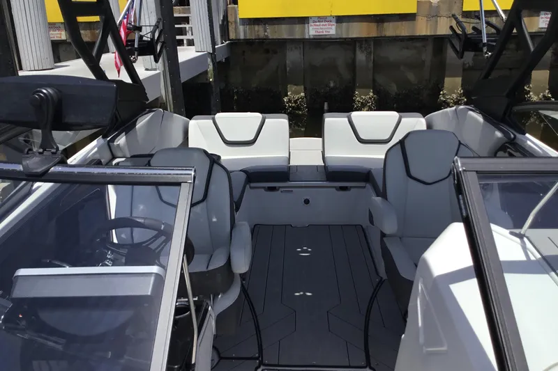 Slide: The Image of 2023 Yamaha Boats 252XE interior with sleek seating and modern design. - 18