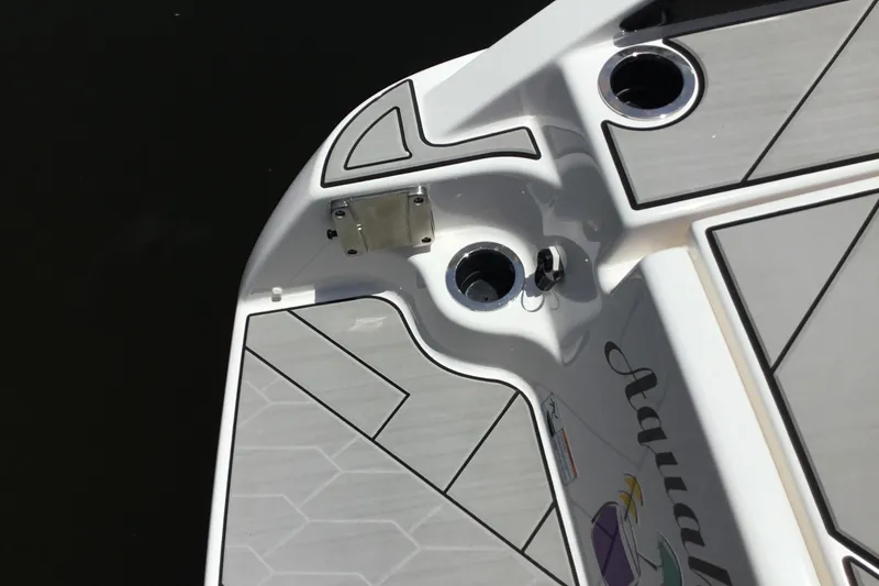Slide: The Image of 2023 Yamaha Boats 252XE swim platform with sleek design and cup holders. - 38