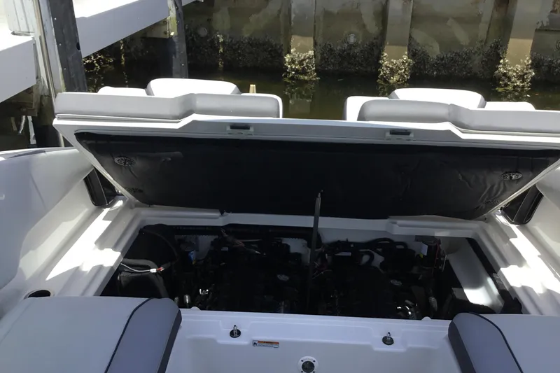 Slide: The Image of Open engine compartment of 2023 Yamaha Boats 252XE, dockside view. - 30