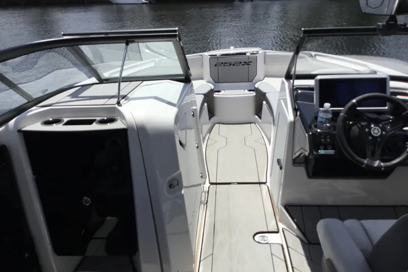 Slide: The Image of 2023 Yamaha Boats 252XE interior with sleek design and modern dashboard. - 13