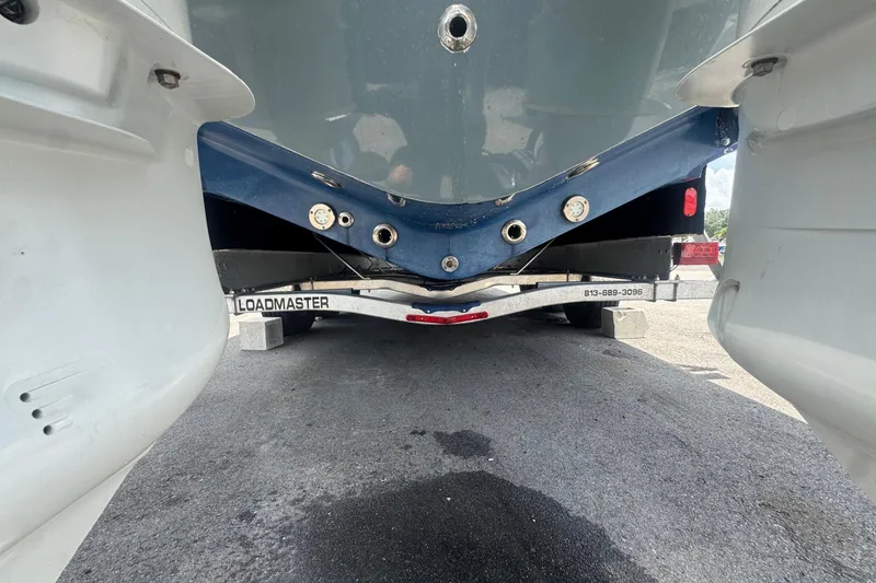Slide: The Image of The hull of a 2007 Contender 33 Tournament on a trailer, featuring a blue underside. - 9