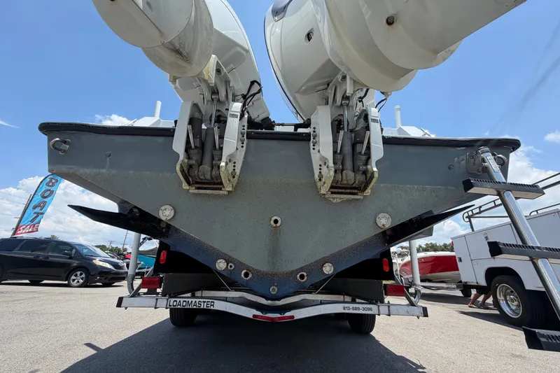 Slide: The Image of 2007 Contender 33 Tournament boat with dual outboard motors on trailer. - 4