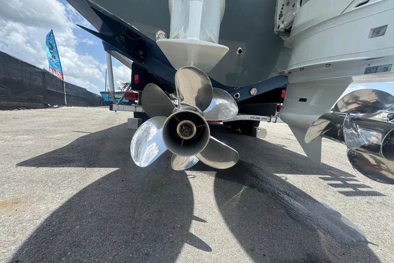 Slide: The Image of Propellers of a 2007 Contender 33 Tournament boat on a sunny day. - 8