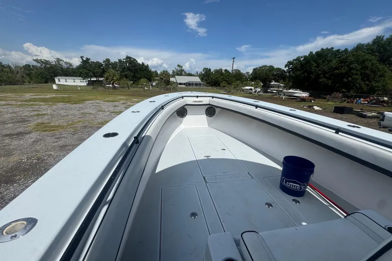 Slide: The Image of 2007 Contender 33 Tournament boat deck with open space and blue bucket. - 16