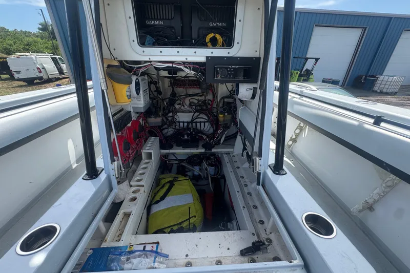 Slide: The Image of Interior view of a 2007 Contender 33 Tournament boat showing electronic equipment and storage. - 18