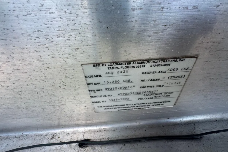 Slide: The Image of Label on Loadmaster aluminum boat trailer, detailing specifications and manufacturing information. - 23