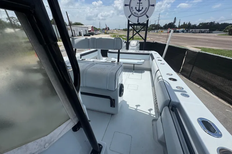 Slide: The Image of 2007 Contender 33 Tournament boat interior with seating and fishing rod holders. - 58