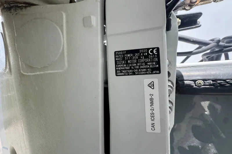Slide: The Image of Label on a 2020 Suzuki motor, attached to a 2007 Contender 33 Tournament boat. - 75
