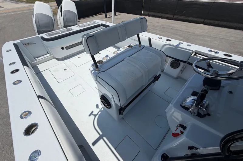 Slide: The Image of 2007 Contender 33 Tournament boat interior with seating and steering console. - 26