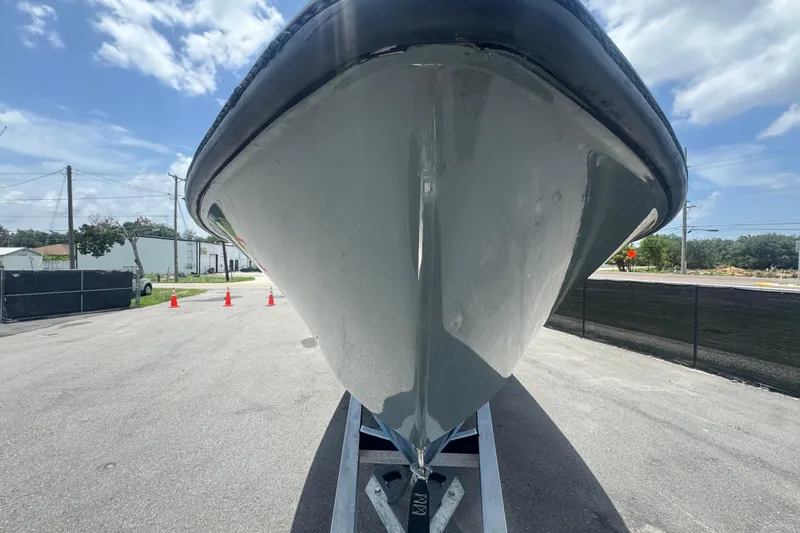 Slide: The Image of 2007 Contender 33 Tournament boat on trailer, viewed from the front under a clear sky. - 16
