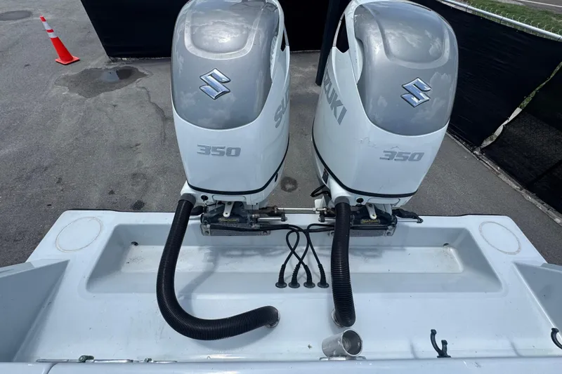 Slide: The Image of Twin Suzuki 350 outboard engines on a 2007 Contender 33 Tournament boat. - 70