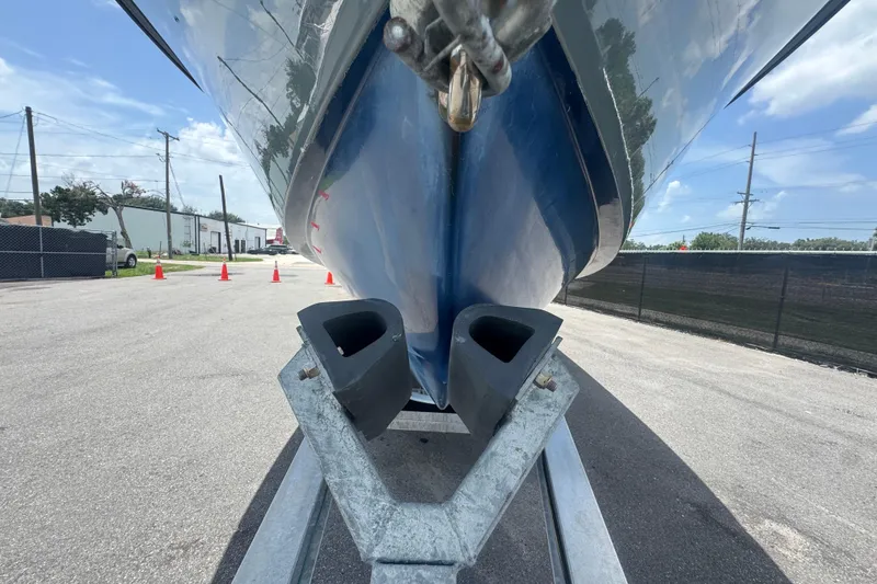 Slide: The Image of 2007 Contender 33 Tournament boat on trailer, viewed from below, outdoors. - 17