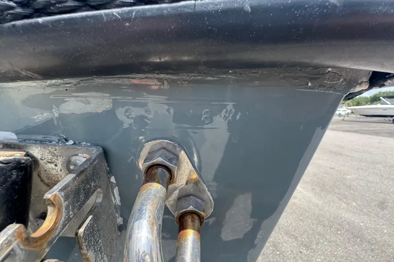 Slide: The Image of Close-up of a 2007 Contender 33 Tournament boat hull with metal fittings. - 82