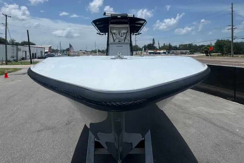 Slide: The Image of 2007 Contender 33 Tournament boat on trailer under a clear blue sky. - 15