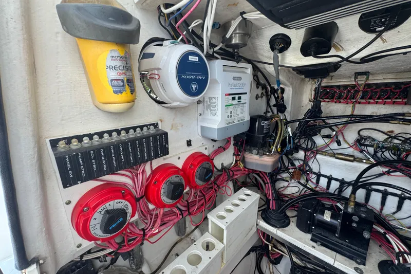Slide: The Image of Electrical system of a 2007 Contender 33 Tournament boat, featuring wiring and control panels. - 52