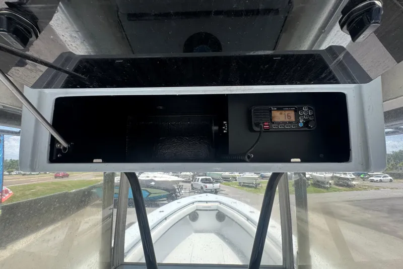 Slide: The Image of 2007 Contender 33 Tournament boat console with radio equipment and storage compartment. - 29