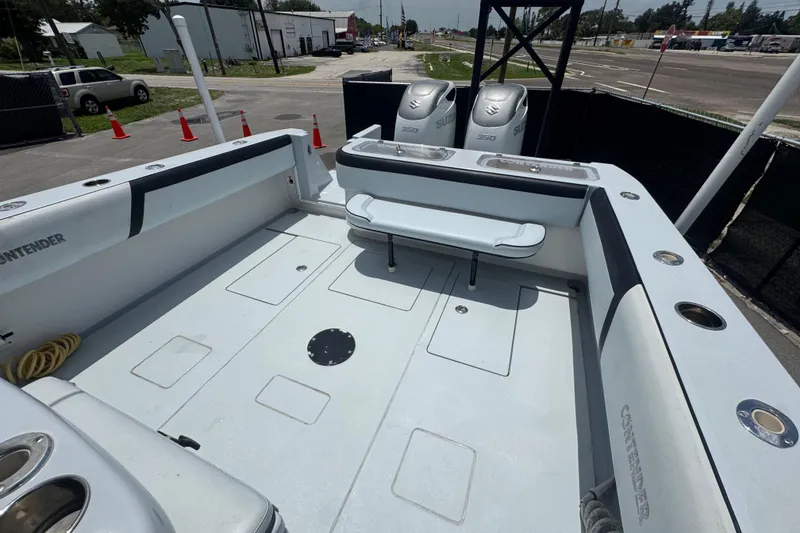 Slide: The Image of 2007 Contender 33 Tournament boat deck with dual Suzuki engines, spacious layout. - 61