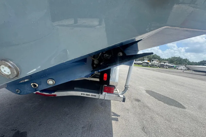 Slide: The Image of 2007 Contender 33 Tournament boat on trailer, rear view, in a parking lot. - 11