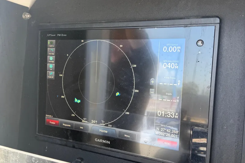 Slide: The Image of Garmin GPS display on a 2007 Contender 33 Tournament boat, showing navigation data. - 17