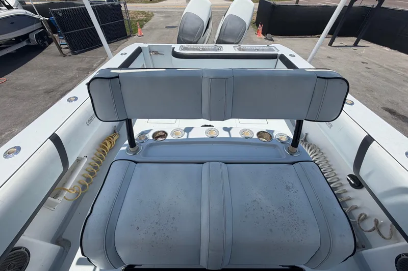 Slide: The Image of 2007 Contender 33 Tournament boat interior with seating and fishing rod holders. - 27