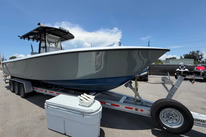 Slide: The Image of 2007 Contender 33 Tournament boat on trailer under clear blue sky. - 9