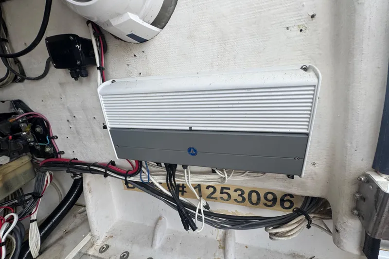 Slide: The Image of Electrical panel inside a 2007 Contender 33 Tournament boat, showcasing wiring and components. - 53