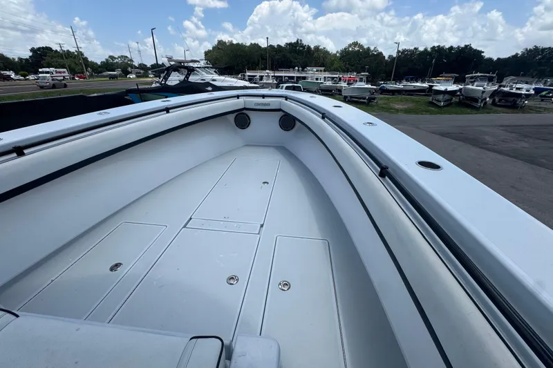 Slide: The Image of 2007 Contender 33 Tournament boat deck, spacious and clean, under a partly cloudy sky. - 40