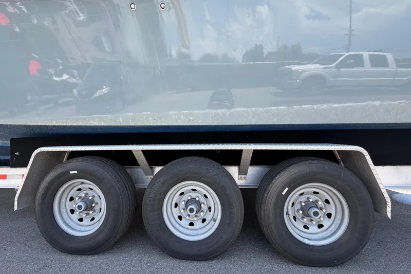 Slide: The Image of Trailer with three wheels for 2007 Contender 33 Tournament boat. - 34