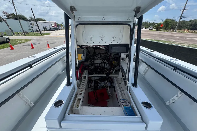 Slide: The Image of 2007 Contender 33 Tournament boat interior showing open engine compartment and wiring. - 50
