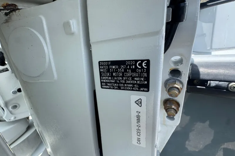 Slide: The Image of Label on a 2020 Suzuki motor, showing power and mass specifications. - 74