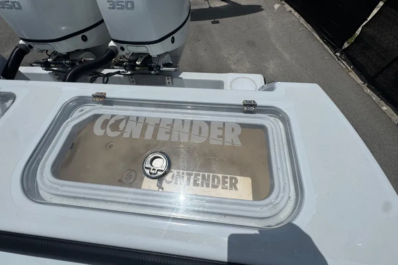 Slide: The Image of 2007 Contender 33 Tournament boat with dual 350 engines, featuring a clear hatch. - 67