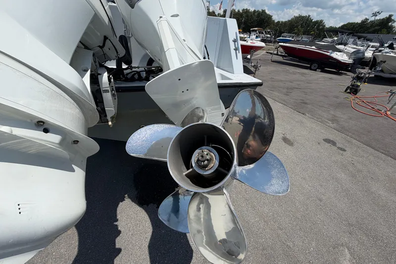 Slide: The Image of 2007 Contender 33 Tournament boat propeller in a marina setting. - 6