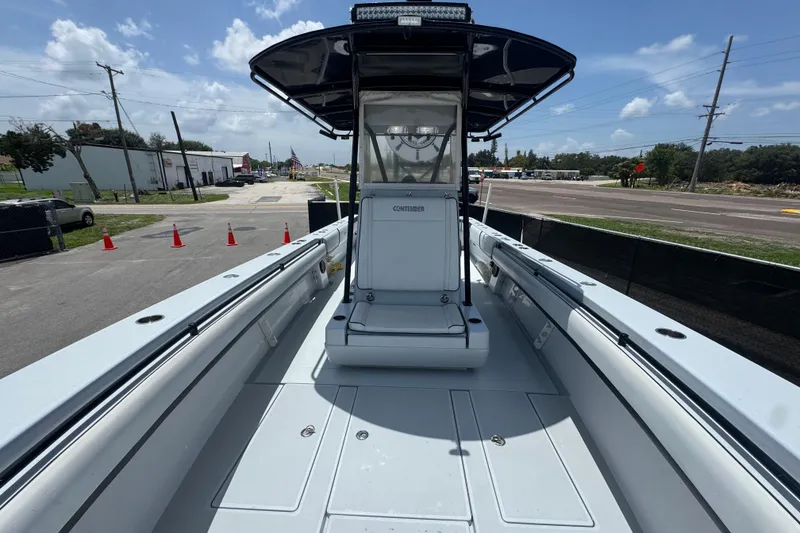 Slide: The Image of 2007 Contender 33 Tournament boat, docked, with clear skies and road in background. - 48