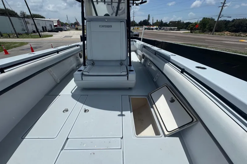 Slide: The Image of The image shows the deck of a 2007 Contender 33 Tournament boat with storage compartments. - 47