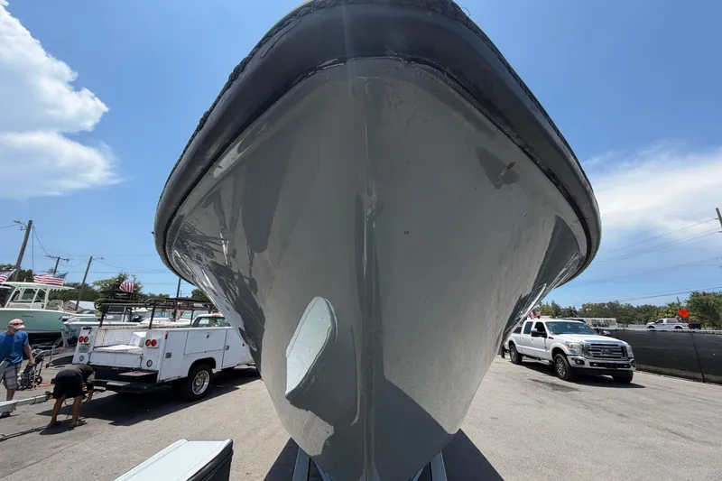 Slide: The Image of 2007 Contender 33 Tournament boat on trailer, viewed from the front, under a clear blue sky. - 10
