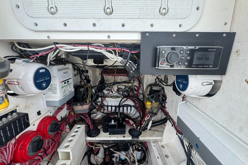 Slide: The Image of Electrical system of a 2007 Contender 33 Tournament boat, featuring wiring and control panels. - 51