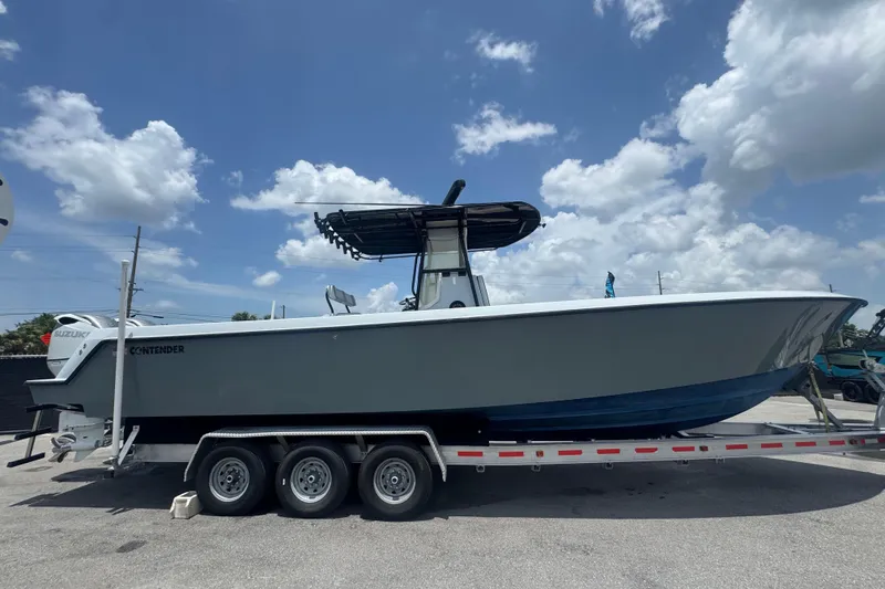 Slide: The Image of 2007 Contender 33 Tournament boat on trailer under blue sky with clouds. - 2