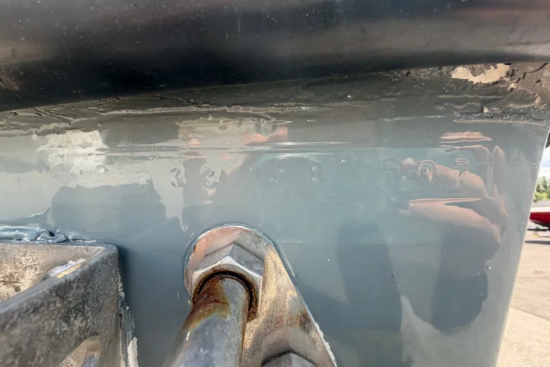 Slide: The Image of Close-up of a 2007 Contender 33 Tournament boat hull with visible reflections. - 31