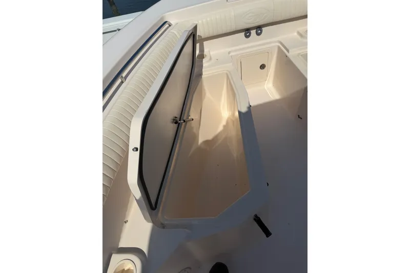Slide: The Image of Open storage compartment on a 2008 Grady-White Canyon 336 boat deck. - 10