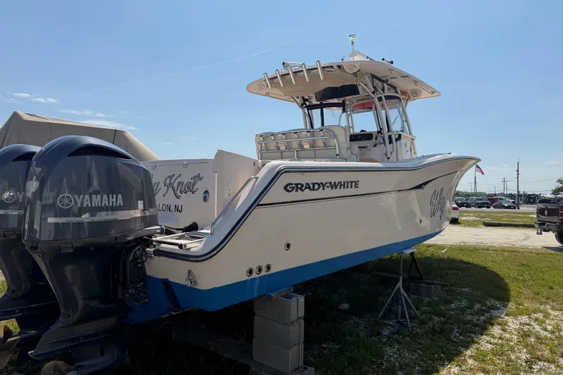 Slide: The Image of 2008 Grady-White Canyon 336 boat with Yamaha engines, parked on a grassy area. - 13