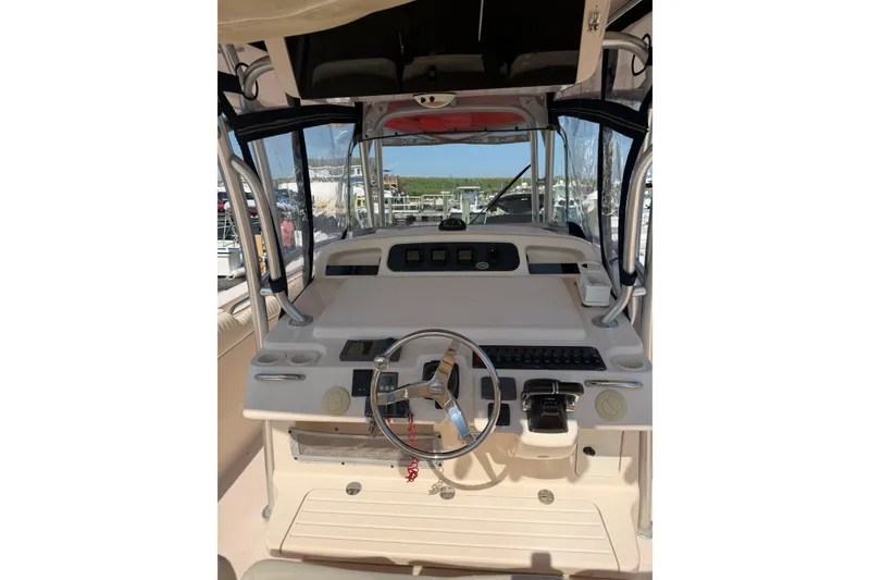 Slide: The Image of 2008 Grady-White Canyon 336 boat helm with steering wheel and controls. - 5