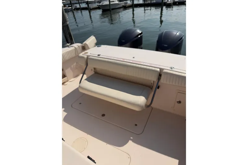 Slide: The Image of 2008 Grady-White Canyon 336 boat with foldable seat and twin engines at dock. - 9
