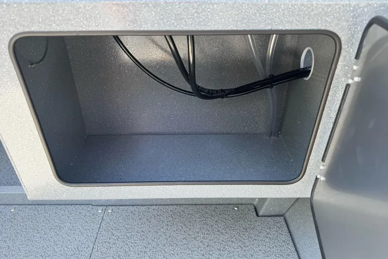 Slide: The Image of Storage compartment of 2027 KingFisher 2025 Escape HT boat, featuring internal wiring. - 19