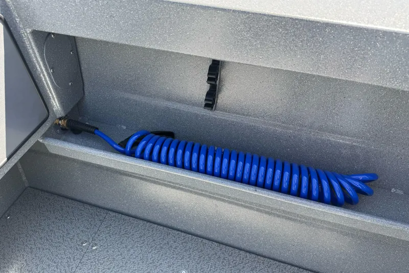 Slide: The Image of Blue coiled hose in KingFisher 2025 Escape HT boat storage compartment, 2027 model. - 15
