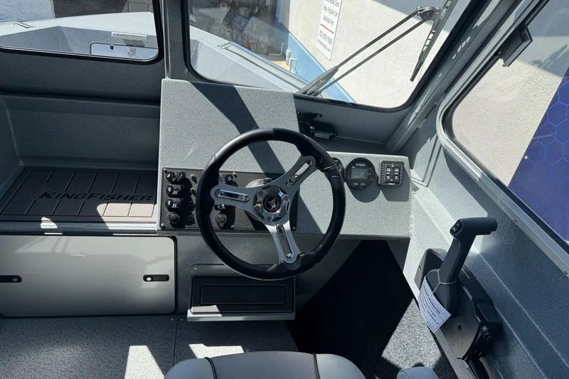 Slide: The Image of Interior view of 2027 KingFisher 2025 Escape HT boat cockpit with steering wheel and controls. - 28